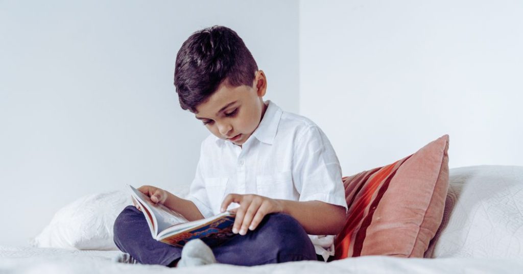 a boy reading a book